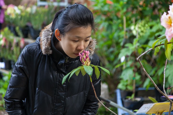 Mama smelling the flowers